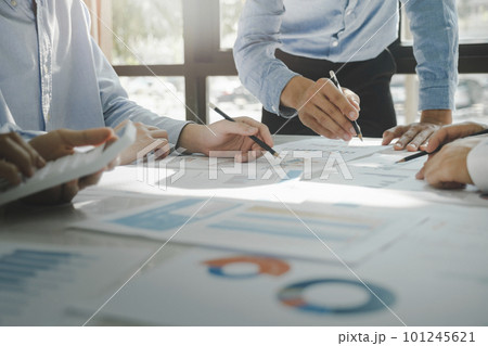 Businessmen working together at desk. 101245621