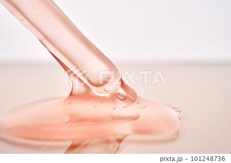 Pipette with a viscous pink cosmetic close-up. Pipette with a viscous pink cosmetic close-up. 101248736