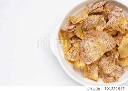 Crispy taro chips on white background. 101251945