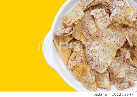 Crispy taro chips on white background. 101251947