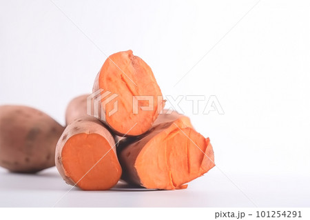 Close up of sweet potatoes on white background with copy space. Healthy vegan vegetarian food concept 101254291
