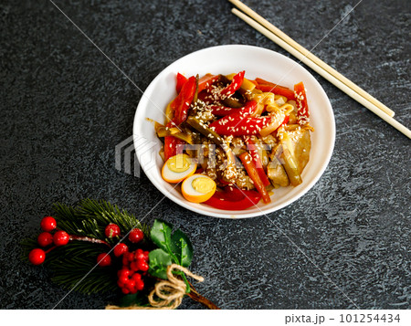 A bowl of soba noodles with mushrooms, onions and A bowl of soba noodles with mushrooms, onions and 101254434