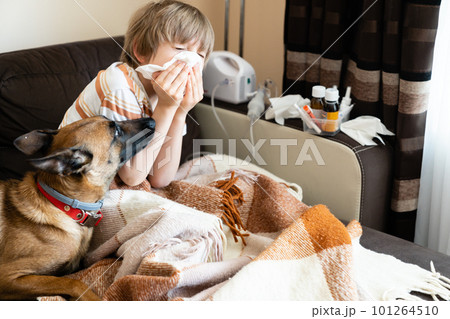 Sick child on the sofa at home Sick child on the sofa at home 101264510