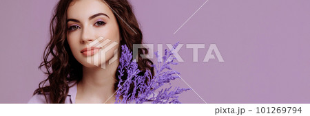 Attractive woman with bouquet on lilac background Attractive woman with bouquet on lilac background 101269794