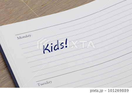 Kids reminder note in blue ink in a diary page Kids reminder note in blue ink in a diary page 101269889