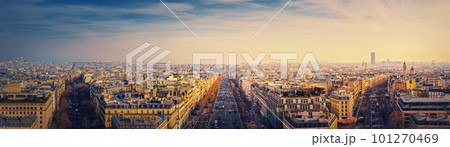 Paris cityscape sunset panorama from the triumphal arch with view to parisian avenues and Champs-Elysee in the center. Beautiful architectural landmarks on the horizon Paris cityscape sunset panorama from the triumphal arch with view to parisian avenues and Champs-Elysee in the center. Beautiful architectural landmarks on the horizon 101270469