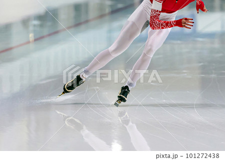 slim female skaters run race in speed skating competition, winter sports games 101272438