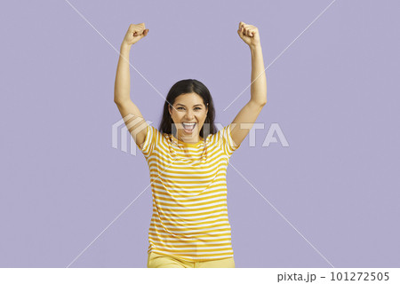 Happy emotional young woman sincerely rejoices in her success isolated on pastel purple background. Happy emotional young woman sincerely rejoices in her success isolated on pastel purple background. 101272505
