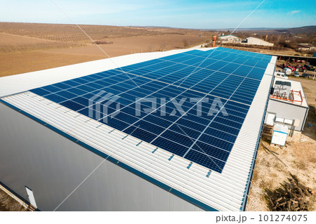 Multiple solar panels on the roof of a manufacturing building Multiple solar panels on the roof of a manufacturing building 101274075