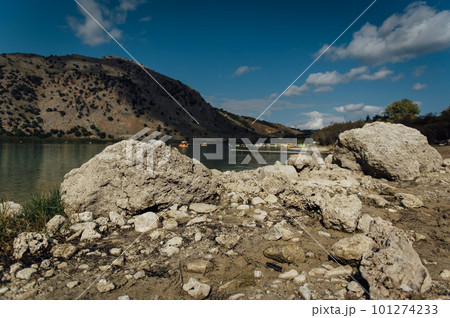 Kournas Mountain Lake in Greece. Cozy summer day and calm water in the lake Kournas Mountain Lake in Greece. Cozy summer day and calm water in the lake 101274233