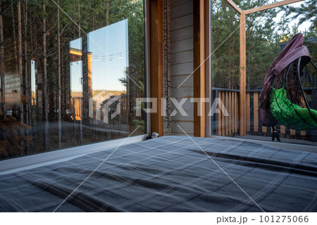 Bedroom with a view of the forest and sky 101275066