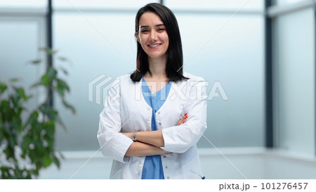 Confident female doctor posing in her office 101276457