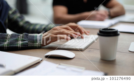 Close-up of male hands typing on laptop keyboard 101276490