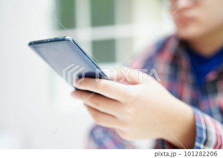 Asian teenage using mobile application in digital smartphone technology for learning. 101282206