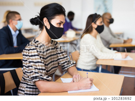 Asian woman in protective mask during lesson in school for adults 101283692
