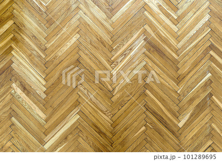 Wooden parquet floor background. Old vintage parquet on the floor in the living room. Interior design concept. 101289695
