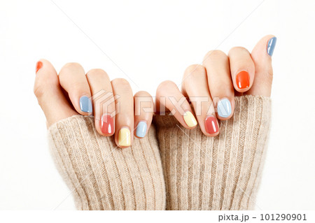 Beautiful female hand painting acrylic gel nails. Fashion style. White background. 101290901