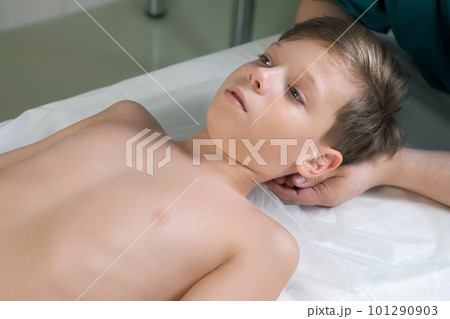 Session of craniosacral therapy, cure of teen boy's neck by a doctor therapist. Session of craniosacral therapy, cure of teen boy's neck by a doctor therapist. 101290903