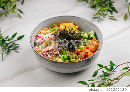 Portion of salmon poke bowl with vegetables 101292120