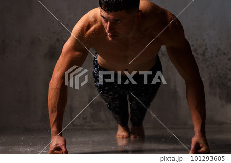 A guy in a great sports uniform in the studio on a gray background. A guy in a great sports uniform in the studio on a gray background. 101293605