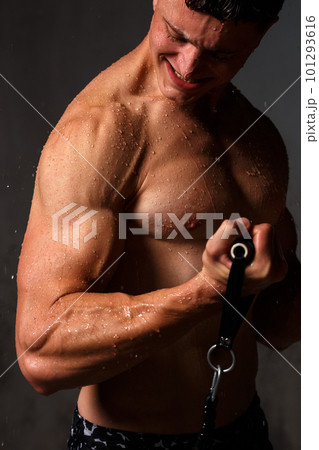 A guy in a great sports uniform in the studio on a gray background. A guy in a great sports uniform in the studio on a gray background. 101293616