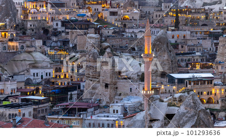 Goreme City at twilight, Famous tourist center of balloon fligths in Cappadocia, Turkiye, Aerial view twilight Goreme City from the mountain, Night view of Goreme, Cappadocia, Turkey. 101293636