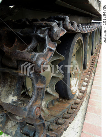 Wheels and suspension of rare tracked war machine with dirt and rust on a tracks Wheels and suspension of rare tracked war machine with dirt and rust on a tracks 101294786