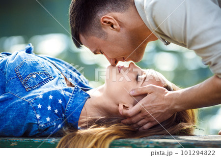 Couple in love enjoying tender moments during sunset . Couple in love enjoying tender moments during sunset . 101294822