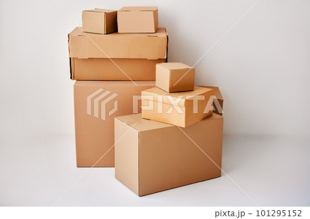 Heap of cardboard boxes on white backround 101295152