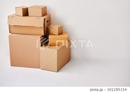 Heap of cardboard boxes on white backround 101295154