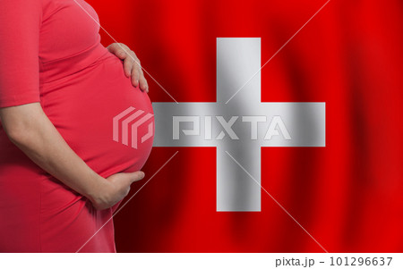 Pregnant woman belly on Swiss flag background Pregnant woman belly on Swiss flag background 101296637