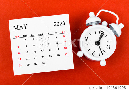The May 2023 Monthly calendar year with alarm clock on red background. The May 2023 Monthly calendar year with alarm clock on red background. 101301008