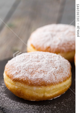 Ruddy donuts berliners on a stone board 101301445