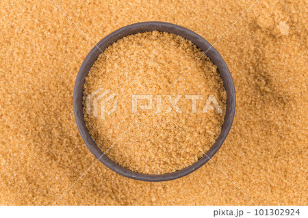 brown sugar in dark bowl brown sugar in dark bowl 101302924