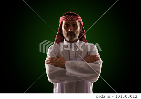 Arab man in traditional Islamic clothing and immersed in Sharia culture, with emphasis on religious customs, architecture, and lifestyle. Essence of Middle Eastern heritage, history, and spirituality 101303012