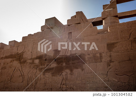 Different hieroglyphs on the walls and columns in the Karnak temple. Karnak temple is the largest complex in ancient Egypt. 101304582