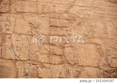 Different hieroglyphs on the walls and columns in the Karnak temple. Karnak temple is the largest complex in ancient Egypt. 101304587