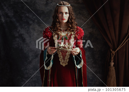 medieval queen in red dress with crown 101305675