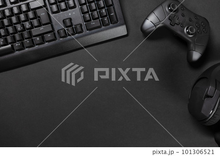 Top view of gaming desk with keyboard by game controller and mouse Top view of gaming desk with keyboard by game controller and mouse 101306521