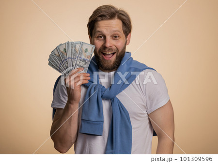 Rich pleased boss man waving money dollar cash, success business career, lottery winner big income 101309596