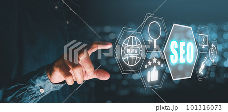 SEO Concept, Search Engine Optimization, Man hand touching virtual screen seo icon, concept for promoting ranking traffic on website, optimizing your website to rank in search engines. 101316073