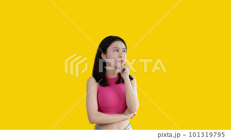 Young Asian woman thinking hard or planning to do something, Overthinking or worrying, Have a headache, Migraine, Stress, Free space for advertising or promoting products, Copy space, Enter text. Young Asian woman thinking hard or planning to do something, Overthinking or worrying, Have a headache, Migraine, Stress, Free space for advertising or promoting products, Copy space, Enter text. 101319795