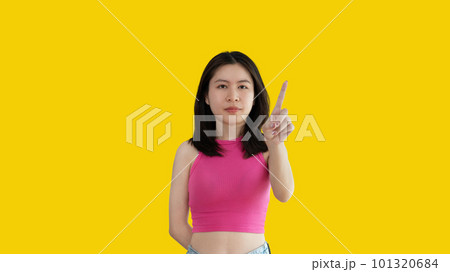 Young woman making hand sign to stop behavior or gesture that suggests unethical and illegal behavior, Reminders to stop exercising help, Woman isolated on white background, Prohibit, Hinder, Hamper. Young woman making hand sign to stop behavior or gesture that suggests unethical and illegal behavior, Reminders to stop exercising help, Woman isolated on white background, Prohibit, Hinder, Hamper. 101320684