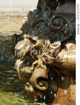 Kiev, Ukraine June 14, 2021: Ancient city fountain with a lion's face 101321355