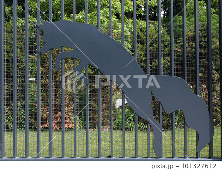 Kiev, Ukraine July 6, 2021: Artistic decoration of the facade of the fence with images of zoo animals in the center of Kiev 101327612