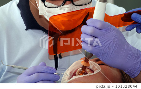 Kiev, Ukraine August 22, 2020: Dentist doctor works with a patient close-up 101328044