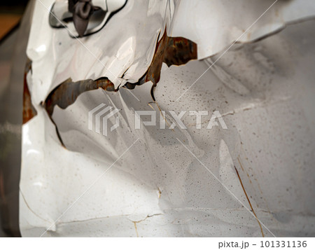 Extreme dents and Paint cracks are dislodged from parts of the accident car Extreme dents and Paint cracks are dislodged from parts of the accident car 101331136