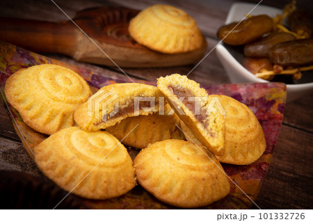Traditional eid maamoul or mamoul cookies with dates, nuts, and jam, Arabic sweets for Aid al-Fitr Traditional eid maamoul or mamoul cookies with dates, nuts, and jam, Arabic sweets for Aid al-Fitr 101332726