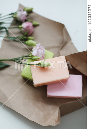 top view of natural decorated homemade soap with flowers on white surface. spa organic soap. Natural vegan soap with rose fragrance 101335575