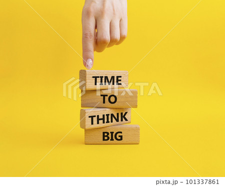 Time to think big symbol. Wooden blocks with words Time to think big. Beautiful yellow background. Businessman hand. Business and Time to think big concept. Copy space. Time to think big symbol. Wooden blocks with words Time to think big. Beautiful yellow background. Businessman hand. Business and Time to think big concept. Copy space. 101337861